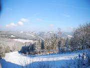 View from the observation terrace of the upper part of the ski slope