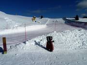 Children's slope with covered magic carpet on Passo Coe
