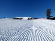 Perfect slope preparation in the ski resort of Stöten