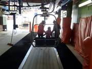 Children are assisted during boarding at the chairlift