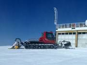 Snowcat in front of its garage at 3200 m