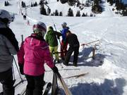 Poles are handed to skiers and snowboarders at most tow lifts and button lifts