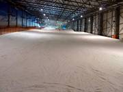 Groomed slope in the Snow Arena ski hall