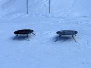 Place to sit while fastening your snowboard