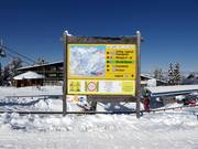 Information board with trail map in the ski resort