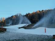 Artificial snow production on the valley run to Pill