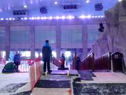 The friendly staff supervises the conveyor belt.