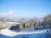 View from the observation terrace of the upper part of the ski slope
