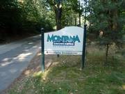 Signpost to the Montana Snowcenter indoor ski hall