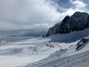 View of the ski area with drag lifts, snow park, and glacier cross-country trail