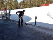 The platform of the gondola lift is being cleaned.
