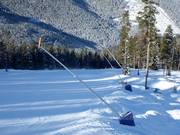Snow lances at the edge of the slope in Panorama