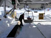 Small children are assisted when boarding