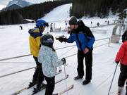 The friendly employee scans the ski pass