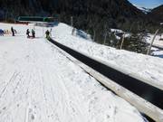 Conveyor belt/magic carpet at the valley station of the Täli and Hochegg chairlifts