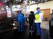 The staff assists with boarding