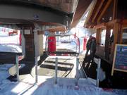 Staff is present at the chairlift.