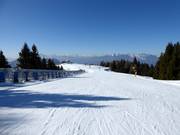 Covered conveyor belt and practice slope at the summit of Martinella