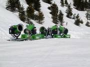 Snow cannons at the edge of the slope