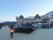Friendly parking attendants manage the traffic in the parking lot.