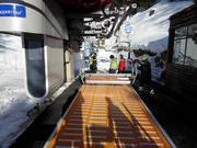 The staff assists with boarding the chairlifts.