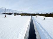 Conveyor belt next to the valley station of the gondola lift