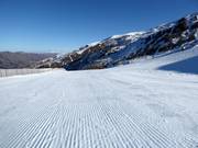 Perfectly groomed slope in the ski resort of Cardrona