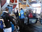 Staff assists with boarding at the valley station