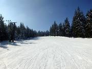 Snow-covered winter landscape and dream slopes