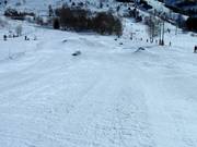 Children's fun park with boxes in the valley near the beginner lifts