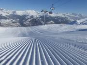Perfectly groomed slope in the Obersaxen ski resort