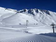 Perfectly groomed slope in the First ski area