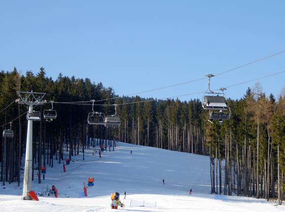 Wide forest run at the 4-seater chairlift