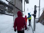 Poles are handed to skiers at the button lifts