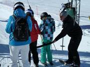 Staff assist winter sports enthusiasts at the tow lifts