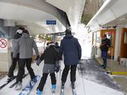 Staff is present at the chairlift.