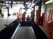 Children are assisted when boarding the chairlift.