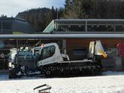 The snow groomers are waiting at the valley station for their deployment.