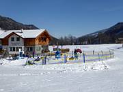 Children's carousel at the valley station in Pichl