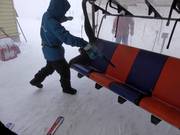 When it snows, the snow is blown off the seat.