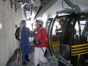 Staff remove skis from the gondola lifts on the Pezid