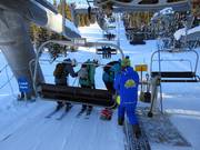 Guests are assisted during boarding of the chairlifts