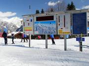 A large display board is located directly at the mountain station of the gondola lift