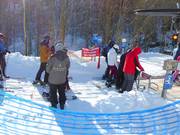 The staff monitors the entry at the chairlift.