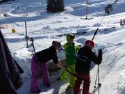 Poles are handed to skiers at most of the tow lifts