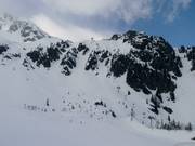 Open and steep ski terrain at the Cornu six-seater chairlift