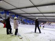 Slope start in the Snowplanet indoor ski hall