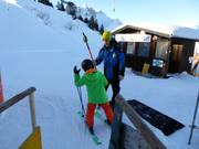 At the platter lift, children are assisted when getting on.
