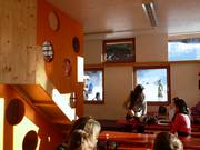 In the kids' room, there is food and space to play.