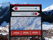 Modern slope signage with piste map in Ischgl